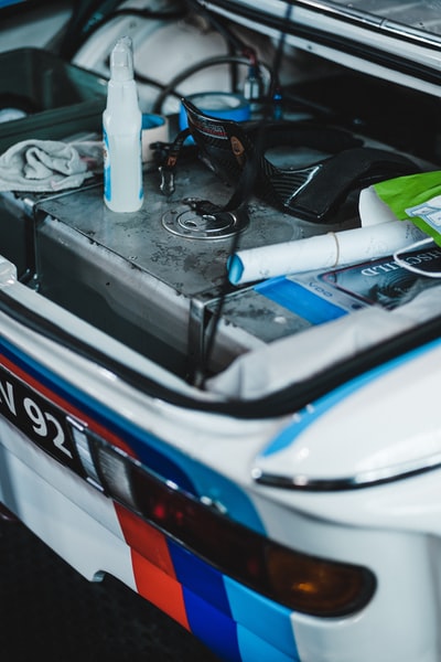 white and blue car engine bay